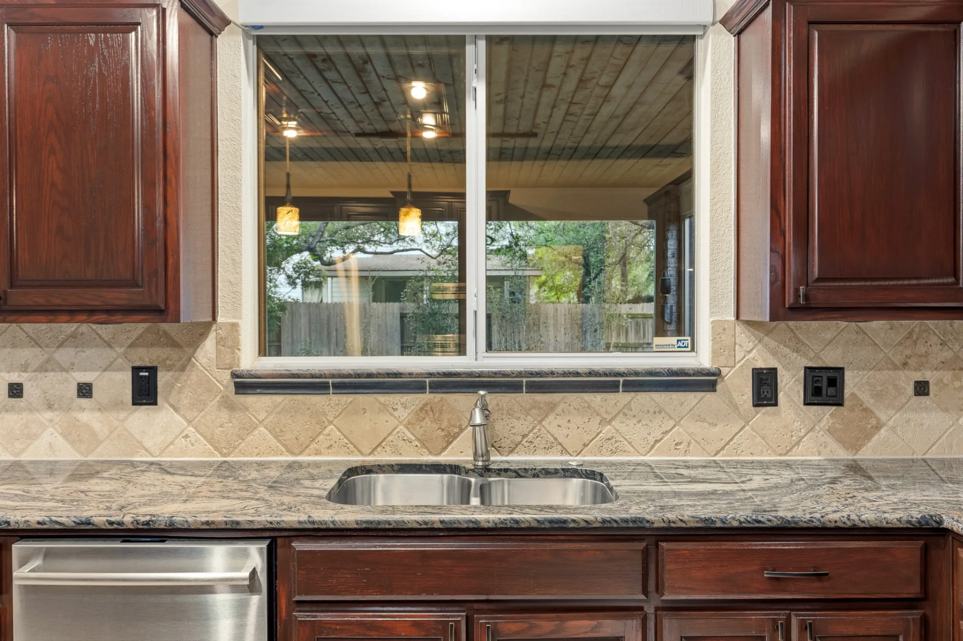 Kitchen sink and window overlooking the screened patio