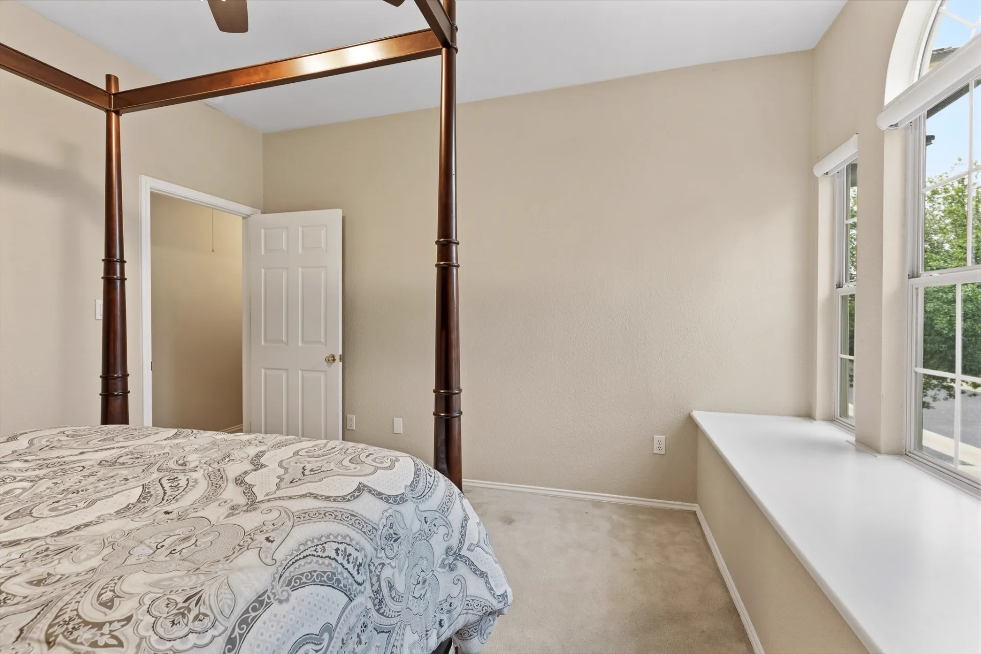 Guest bedroom with closet entry and window seat